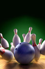 Bowling ball hitting pins