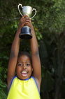 Motivated child with trophy